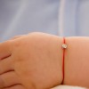 Piros cérnaszál gyémánttal babáknak Piros cérnaszál gyémánttal babáknak